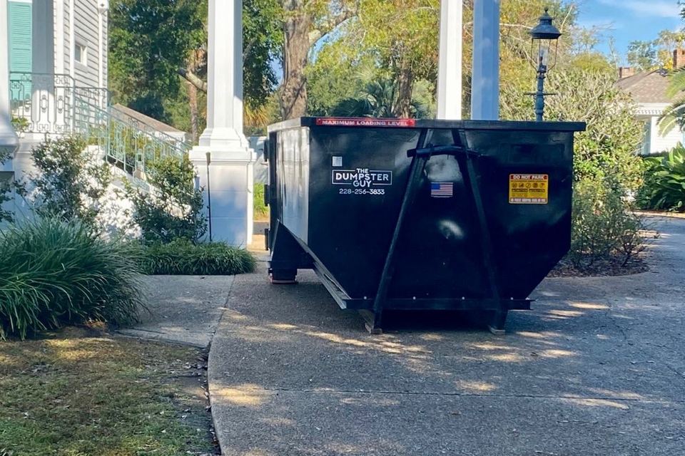 A container standing on a residential driveway
